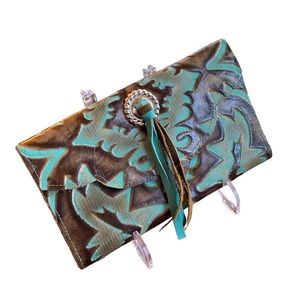 Western leather stamped Clutch.
